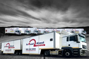 a group of trucks parked on the side of a road